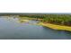 Breathtaking aerial shot of a serene lake surrounded by green forests offering a tranquil setting at 360 Bering Ln, Summerville, SC 29486