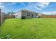 Well-maintained backyard featuring a lawn, privacy fence, and the home's exterior at 360 Bering Ln, Summerville, SC 29486