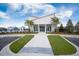 Modern white clubhouse features ample parking and manicured landscaping, convenient for community gatherings and events at 360 Bering Ln, Summerville, SC 29486