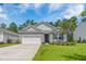 Charming single-story home with gray siding, a well-manicured lawn, and a two-car garage at 360 Bering Ln, Summerville, SC 29486