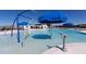 Community pool with a splash zone, umbrellas, lounge chairs, and surrounding seating at 360 Bering Ln, Summerville, SC 29486