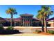 School building with a well-maintained exterior, surrounded by palm trees and lush landscaping at 360 Bering Ln, Summerville, SC 29486