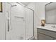 Elegant walk-in shower with white tiling, glass door, and modern fixtures at 360 Bering Ln, Summerville, SC 29486