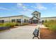 Exterior of the Cane Bay Gathering YMCA with benches and ample parking at 120 Haverhill St, Summerville, SC 29486
