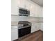Stainless steel appliances, including a microwave and stovetop, built into white cabinets at 120 Palfrey Dr, Ridgeville, SC 29472