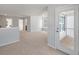 Sun-drenched living room with plush carpeting, neutral walls, and a view of the screen porch at 120 Palfrey Dr, Ridgeville, SC 29472