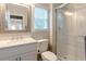 Clean bathroom with white vanity, quartz countertop, and a glass shower at 2 Pelican Reach # Share 10, Isle of Palms, SC 29451