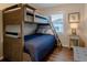 Bedroom with a twin-over-twin bunk bed and a separate single bed at 2 Pelican Reach # Share 10, Isle of Palms, SC 29451