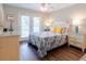Bedroom with a queen-size bed and access to a deck at 2 Pelican Reach # Share 10, Isle of Palms, SC 29451
