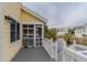 Deck with a view of the water and neighboring houses at 2 Pelican Reach # Share 10, Isle of Palms, SC 29451