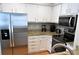 Stainless steel appliances and granite countertops in kitchen at 2 Pelican Reach # Share 10, Isle of Palms, SC 29451