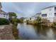 View of the waterway with houses along the water's edge at 2 Pelican Reach # Share 10, Isle of Palms, SC 29451