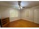 Bedroom featuring hardwood floors, multiple windows, and a ceiling fan at 1229 Central Ave, Summerville, SC 29483