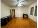 Bedroom with hardwood floors, a ceiling fan, and natural light at 1229 Central Ave, Summerville, SC 29483