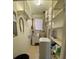 Functional laundry room is equipped with shelving, a washing machine, and dryer at 1229 Central Ave, Summerville, SC 29483