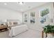 Comfortable bedroom features ample natural light from three windows at 223 Abercom Place Dr, Moncks Corner, SC 29461