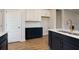 Kitchen featuring dark blue cabinets, marble countertops, modern appliances, and hardwood floors at 427 Grove End Rd, Moncks Corner, SC 29461