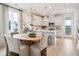 Bright, open kitchen featuring modern appliances, a center island, and adjacent dining area with a round table at 427 Grove End Rd, Moncks Corner, SC 29461
