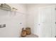 Bright, small laundry room with shelving and storage space, next to a closed door at 427 Grove End Rd, Moncks Corner, SC 29461