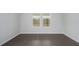 Empty bedroom featuring hardwood floors and a large window at 741 Blue Iris Way, Summerville, SC 29486