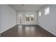 Bright living room featuring hardwood floors and a glass door to the backyard at 741 Blue Iris Way, Summerville, SC 29486