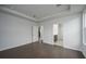 Large bedroom with hardwood floors and doorways leading to the bathroom and kitchen at 741 Blue Iris Way, Summerville, SC 29486
