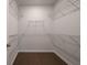 Spacious walk-in closet features adjustable wire shelving and dark hardwood floors at 741 Blue Iris Way, Summerville, SC 29486