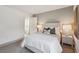 Bedroom with neutral paint, two nightstands, and an open doorway leading to an adjacent room at 178 Cantona Dr, Summerville, SC 29483