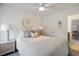 Bright bedroom with neutral colors, a ceiling fan, and a view into the next room via open doorway at 178 Cantona Dr, Summerville, SC 29483
