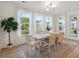 Airy dining room featuring lots of natural light, a wooden table, stylish chairs, and hardwood floors at 178 Cantona Dr, Summerville, SC 29483