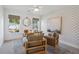 Cozy home office features stylish wallpaper, decor, and a wooden desk near the natural light from the windows at 178 Cantona Dr, Summerville, SC 29483