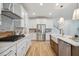 Bright kitchen with white cabinets, stainless steel appliances, a subway tile backsplash, and hardwood floors at 178 Cantona Dr, Summerville, SC 29483
