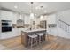 Beautiful kitchen with white cabinets, stainless steel appliances, a center island with seating, and hardwood floors at 178 Cantona Dr, Summerville, SC 29483
