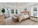 Serene main bedroom with large windows, soft lighting, and a cozy sitting area, perfect for relaxation at 178 Cantona Dr, Summerville, SC 29483