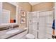 Clean bathroom features a glass-enclosed shower and a vanity with a gray countertop at 163 Seaton Street, Summerville, SC 29486