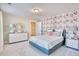 Inviting bedroom showcasing a floral accent wall, plush carpeting, and stylish furnishings at 163 Seaton Street, Summerville, SC 29486