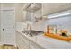 Close-up of a kitchen featuring a gas cooktop with a white countertop and a herringbone tile backsplash at 163 Seaton Street, Summerville, SC 29486