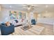 Bright living room with stylish furnishings, a ceiling fan, and a decorative area rug at 163 Seaton Street, Summerville, SC 29486
