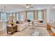 Bright and airy living room with a plush sofa, stylish rug, and an open view into the kitchen at 163 Seaton Street, Summerville, SC 29486