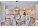 Open floor plan with a view of the dining area, kitchen, and living room with comfortable sofa and decor at 163 Seaton Street, Summerville, SC 29486