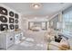 Expansive main bedroom showcasing a tray ceiling, sitting area, and tasteful decor at 163 Seaton Street, Summerville, SC 29486