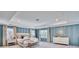 Spacious main bedroom featuring a tray ceiling, stylish wall paneling, and neutral-toned furnishings at 163 Seaton Street, Summerville, SC 29486