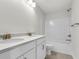 Well-lit bathroom featuring a double vanity with white cabinets and a shower-tub combination at 425 Grove End Rd, Moncks Corner, SC 29461
