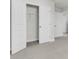 Open closet with shelving, complemented by plush carpeting and a series of pristine white doors at 425 Grove End Rd, Moncks Corner, SC 29461