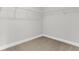 Spacious closet with durable shelving and neutral carpeting, offering ample storage in this well-maintained home at 425 Grove End Rd, Moncks Corner, SC 29461