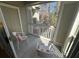 Relaxing balcony with two chairs and a view of the trees at 1600 Long Grove Dr # 628, Mount Pleasant, SC 29464