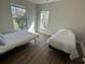 This bedroom is furnished with two cozy twin beds and features hardwood-style flooring at 1600 Long Grove Dr # 628, Mount Pleasant, SC 29464