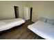 This bedroom is furnished with two cozy twin beds and features hardwood-style flooring at 1600 Long Grove Dr # 628, Mount Pleasant, SC 29464