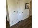 Hallway with white doors, wood flooring, and neutral paint at 1600 Long Grove Dr # 628, Mount Pleasant, SC 29464