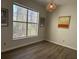 Living area with a large window and modern light fixture at 1600 Long Grove Dr # 628, Mount Pleasant, SC 29464